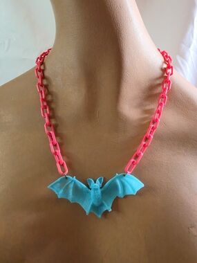 Bright Pink Plastic Link with Blue Bat Necklace.